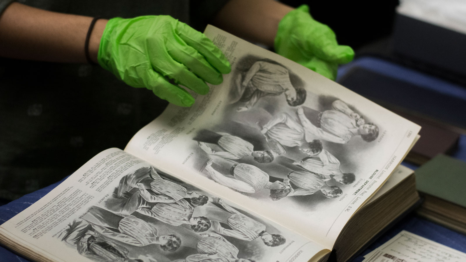 Collections staff member handling a book